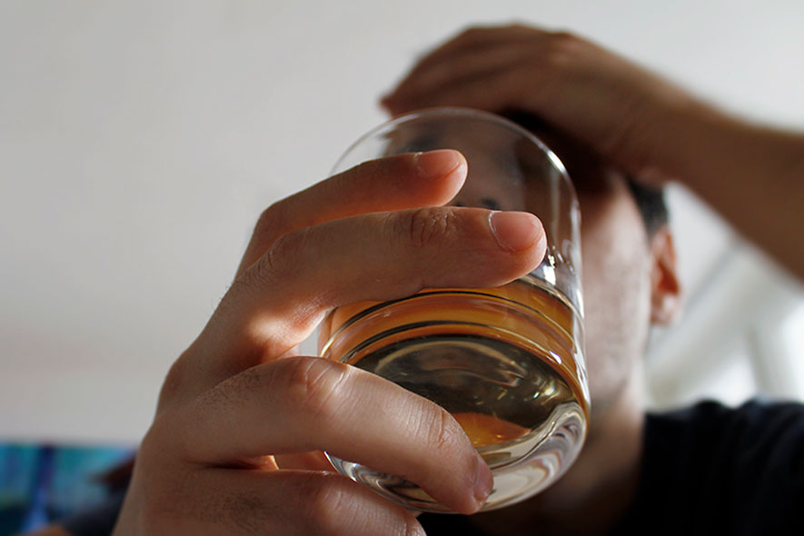man drinking alcohol