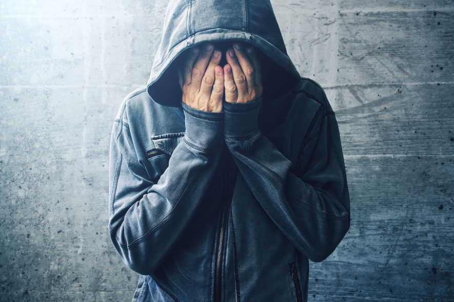 person covering their face